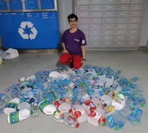 Rishabh Mittal, Founder of Going Green Dubai, recycling plastic bottles with ZeLoop app